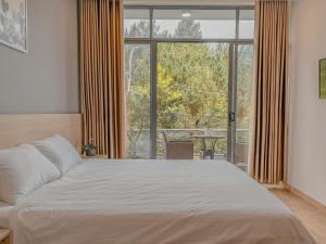 Krevet ili kreveti u jedinici u okviru objekta Lux Nest hotel