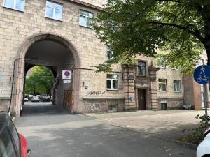 an entrance to a brick building with a tunnel at Cozy Apartment- Self Check- In in Riga