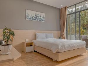 Krevet ili kreveti u jedinici u okviru objekta Lux Nest hotel