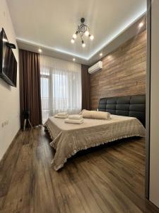 Ένα ή περισσότερα κρεβάτια σε δωμάτιο στο Royalton Résidence