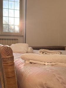 Ένα ή περισσότερα κρεβάτια σε δωμάτιο στο Casa di Cinzia