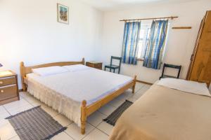 Postel nebo postele na pokoji v ubytování Vrana Lake Houses Kukin