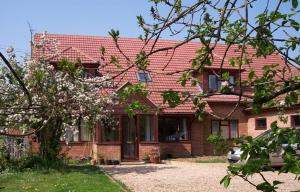 a red brick house with a red roof at Westgrange House Bed & Breakfast in Canterbury