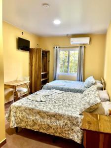 Postel nebo postele na pokoji v ubytování Hotel Virgen De Fatima