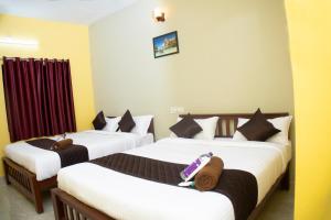 Postel nebo postele na pokoji v ubytování sky suite residency