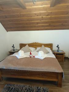 Postel nebo postele na pokoji v ubytování Goralská Vila Lomnica