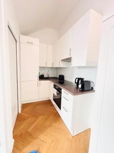 Kuchyň nebo kuchyňský kout v ubytování Simply Five Apartment