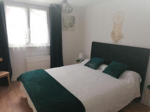 Postel nebo postele na pokoji v ubytování Appartement Chez Pascaline