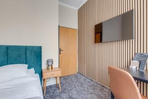TV a/nebo společenská místnost v ubytování Hotel Andante