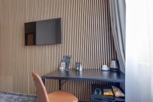 TV a/nebo společenská místnost v ubytování Hotel Andante
