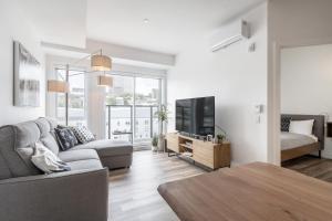 TV a/nebo společenská místnost v ubytování Le Panorama - Parking gratuit - Toit terrasse