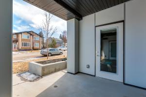 a door to a house with a view of a street at Free Parking, Close to Downtown, Pet Friendly in Calgary