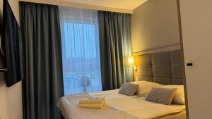 Postel nebo postele na pokoji v ubytování Apartament BELLA D126 + 15 fotografií