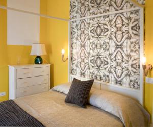 Ένα ή περισσότερα κρεβάτια σε δωμάτιο στο Au Vieux Lavinaio