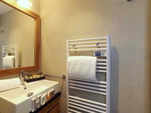a bathroom with a sink and a mirror at Appartement familial 3 chambres à Courchevel, parking et proche des pistes - FR-1-575-130 in Courchevel