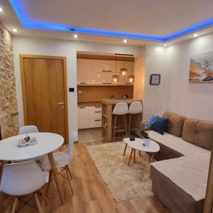 Kuchyň nebo kuchyňský kout v ubytování Lux Apartman Kop Zoned