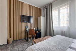 TV a/nebo společenská místnost v ubytování Hotel Andante