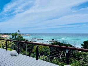 a balcony with a view of the ocean at Driftwood Bay of Fires in Binalong Bay