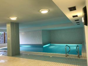 a large swimming pool in a building with at Apartmán 3K Michael in Špindlerův Mlýn