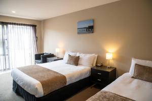Rúm í herbergi á 58 On Cron Motel