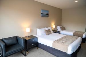 Rúm í herbergi á 58 On Cron Motel