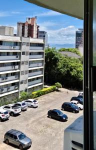 a group of cars parked in a parking lot at João Machado Fortes in Florianópolis