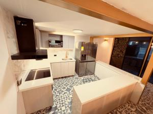a kitchen with a sink and a counter top at Mansion Parque Lleras Poblado Medellin in Medellín