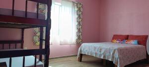 Postel nebo postele na pokoji v ubytování Casa Praia Bellatorres