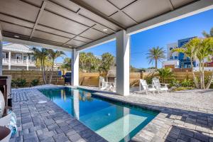 an image of a swimming pool in a house at Sunrise Hideaway - Ocean View Luxury Pool Home - 350 Feet to the Beach in New Smyrna Beach