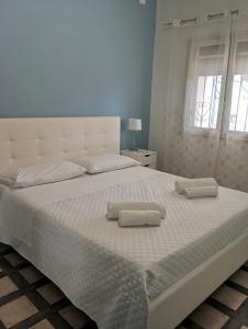 Postel nebo postele na pokoji v ubytování Casa Fronte Mare