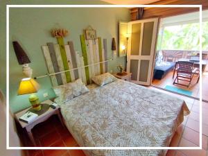 Postel nebo postele na pokoji v ubytování Studio Ti Dô Geo - Anse des Rochers à St François - Guadeloupe
