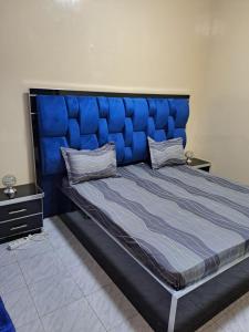 Ένα ή περισσότερα κρεβάτια σε δωμάτιο στο Appartement meublé, Zac Mbao, Rufisque