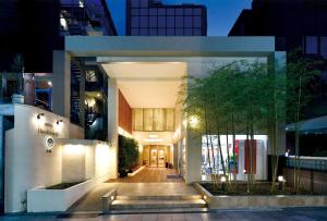 a building with a walkway in a city at night at Hotel Hanakomichi - Vacation STAY 27580v in Nara