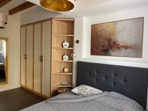 Postel nebo postele na pokoji v ubytování Sunlight Apartment