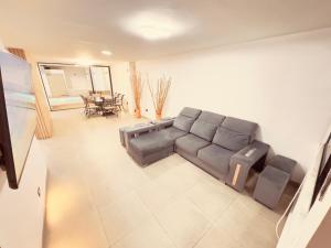 a living room with a couch and a table at Casa Provenza in Medellín +37 photos