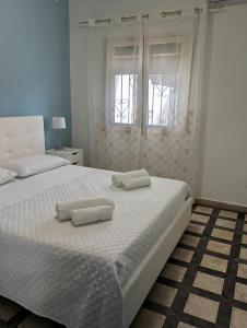 Postel nebo postele na pokoji v ubytování Casa Fronte Mare