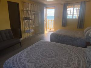 Voodi või voodid majutusasutuse Casa Lassini, Oceanfront Lodging, Playa Las Comadres toas