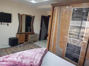 Tempat tidur dalam kamar di Sphinx square, Mohandessin