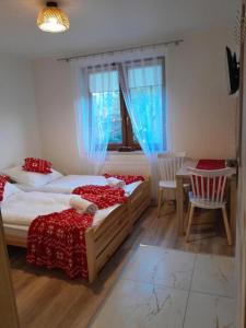 Postel nebo postele na pokoji v ubytování Apartamenty u Joli