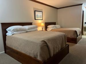 a bedroom with two beds in a room at Arthur Country Inn in Arthur