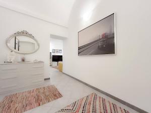 a living room with a large flat screen tv on a wall at Casa Vico Mandorla in Savona