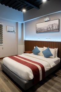 Postel nebo postele na pokoji v ubytování Kekehyu Business Hotel