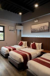 Postel nebo postele na pokoji v ubytování Kekehyu Business Hotel