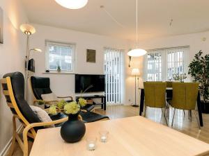 a living room with a table and a dining room at 4 star holiday home in Bogense-By Traum in Bogense