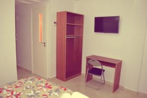 TV a/nebo společenská místnost v ubytování Hotel La Place