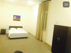 Postel nebo postele na pokoji v ubytování Home inn hotel