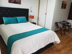 Postel nebo postele na pokoji v ubytování Cusco de mis Sueños Hostal - II