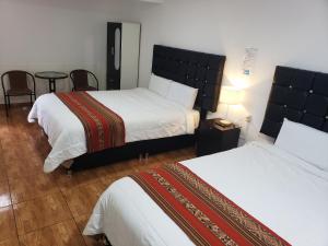 Postel nebo postele na pokoji v ubytování Cusco de mis Sueños Hostal - II