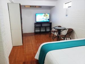Postel nebo postele na pokoji v ubytování Cusco de mis Sueños Hostal - II