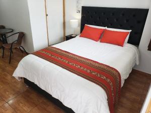 Postel nebo postele na pokoji v ubytování Cusco de mis Sueños Hostal - II